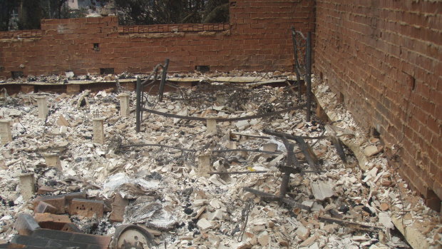 The remains of a bedroom at sergeant Kevin Graham's residence next door to the station.