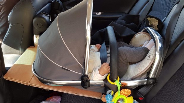 A child found wrongly restrained in an unregistered, uninsured car.