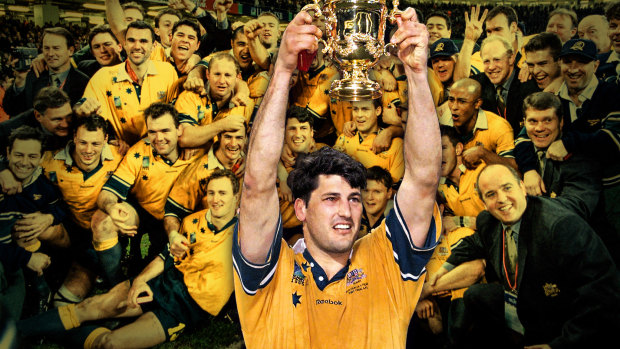 Glory days ... Former Wallabies captain John Eales raises The William Webb Ellis Trophy after the 1999 World Cup.