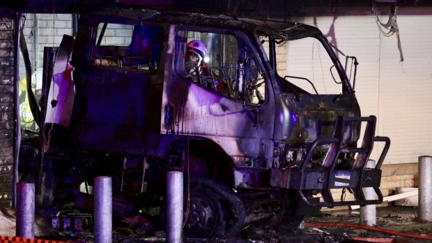 Arson squad detectives are investigating after a truck crashed into a Rockingham tattoo parlour, before a fire engulfed the shop.