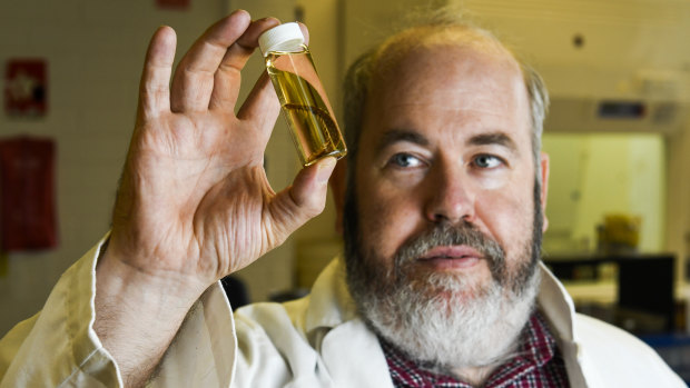 Dr Ben Kefford with a dobsonfly, which he is studying as part of his research on freshwater insects.