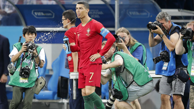 Aquatic Morse code: Portugal's Cristiano Ronaldo spits fluid during a World Cup match in Russia.