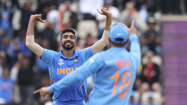 Too good: Jasprit Bumrah and Virat Kohli celebrate a wicket in India's victory over South Africa.