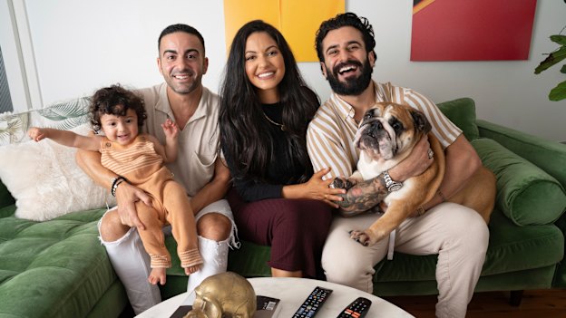 The Gogglebox crew of Jad (left), Sarah-Marie and Matty, with baby Malik and Bane the dog. 