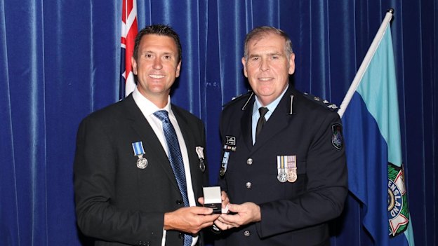 Dan Purdie receives a policing award during his time in the police service. 