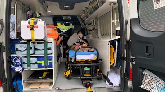 Penny Holmwood is transported by ambulance to hospital.