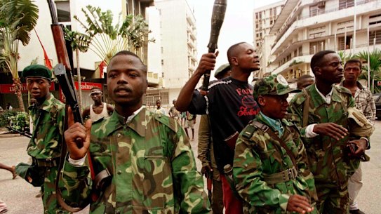 Zairean civil guardsmen patrolling the streets of what is now the Democratic Republic of the Congo.