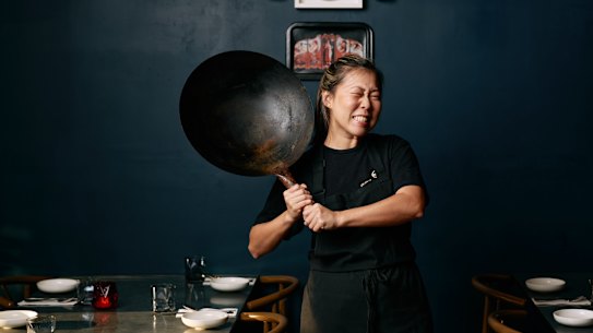 Emily Yeoh with a larger version of the $15 wok she recommends from Yuen’s in Brisbane, or a similar Asian grocery store.