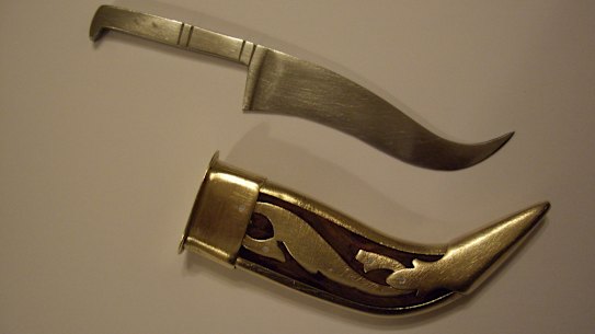 A Kirpan, or ceremonial dagger, is one of five things a baptised Sikh is required to carry on their body. They can range in size from tiny, 4cm knives to long swords. 