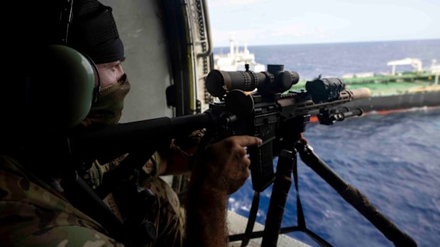 American troops approaching the sanctioned oil tanker, Aquila II, in the Indian Ocean.