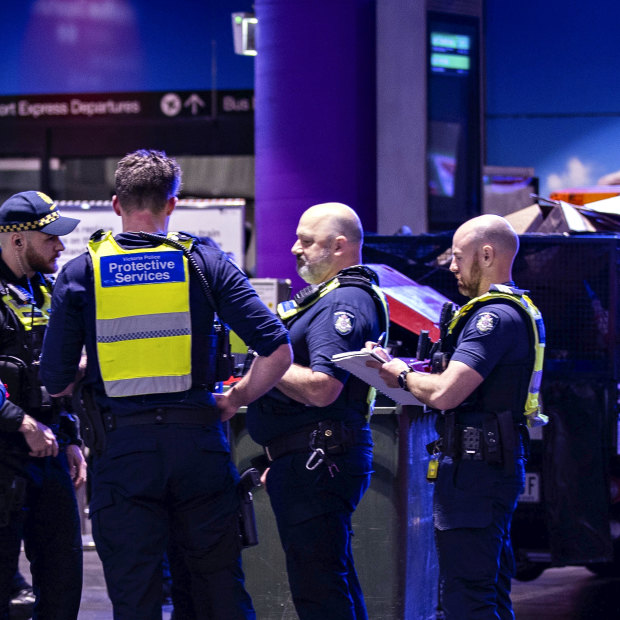 A woman looks on as police respond to an incident at Southern Cross Station on August 31.