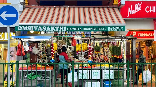 One of the many fresh flower stalls selling marigold garlands in Little India. 