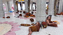 This photograph released by the Phu Manorom temple shows monks who were slightly injured from a crash in Mukdahan province taking rest at Phu Manorom temple in Mukdahan province, Thailand.