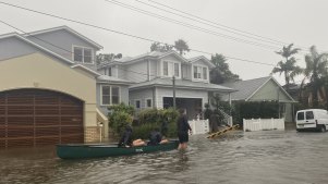 Residents evacuate low-lying areas around Narrabeen Lagoon.