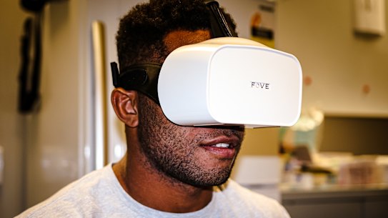 Queensland Reds winger Filipo Daugunu trials the new eye-tracking virtual reality technology. 