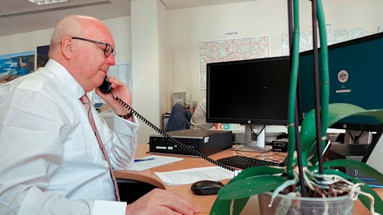 Australia's High Commission to the United Kingdom, George Brandis, does a shift at the coronavirus emergency hotline.