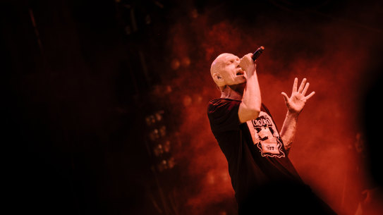 Peter Garrett, on stage with Midnight Oil, in Launceston, during the Resist tour.