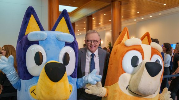 Prime Minister Anthony Albanese with characters from ABC program ‘Bluey’