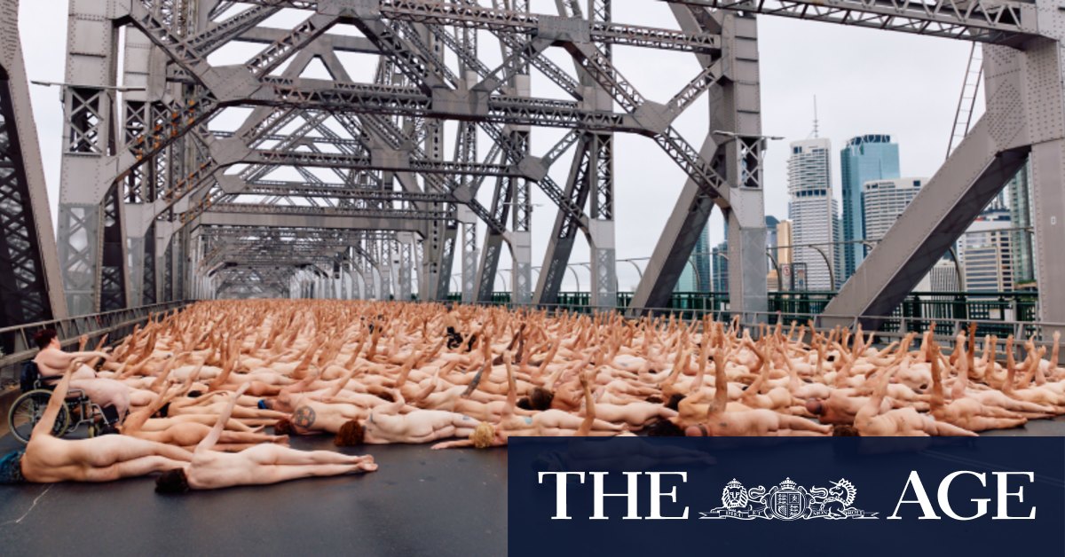 Nude awakening: Thousands flock to Story Bridge for dawn art shoot