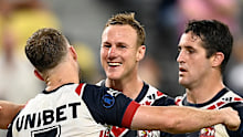 Daly Cherry-Evans celebrates with Sam Walker and Nat Butcher.