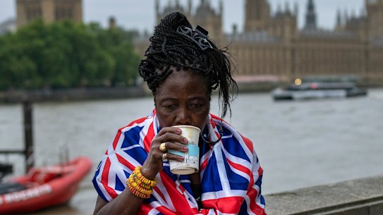 Vanessa, Anne and Grace, from left to right, have breakfast as they wait opposite the Palace of Westminster.