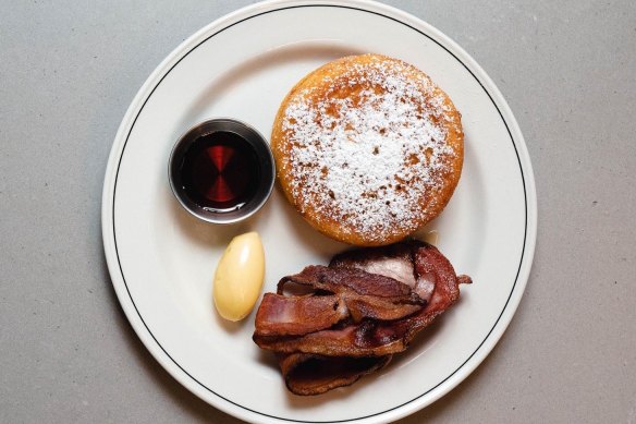 Maverick’s airy ricotta pancakes with bacon and syrup.