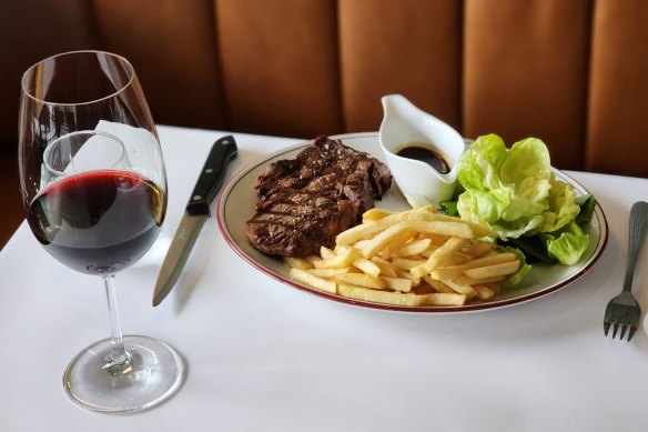 Steak frites is served with either bordelaise or bearnaise sauce and salad at Normandy Wine and Grill.