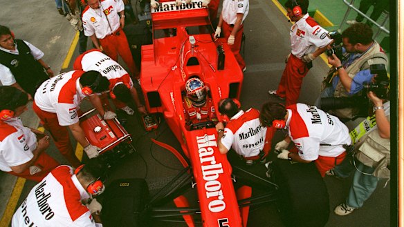 Ferrari mechanics work on Michael Schumacher's car at Albert Park in 1997.