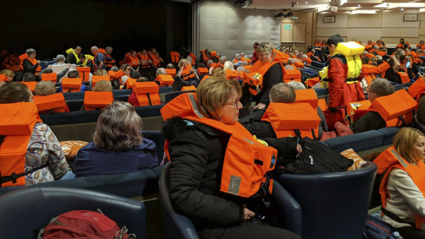 Passengers on board the Viking Sky wait to be evacuated.
