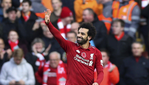Liverpool's Mohamed Salah celebrates scoring his side's first goal against Fulham at Anfield on Sunday.