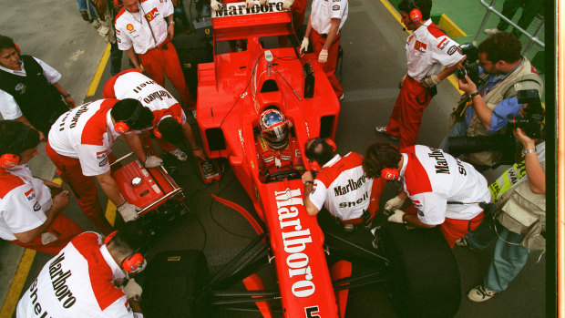 Ferrari mechanics work on Michael Schumacher's car at Albert Park in 1997.