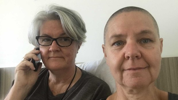 Sydney woman Sandra McFaul (left) has been in quarantine with partner  Fiona Barnett ahead of her father's funeral in north Queensland.