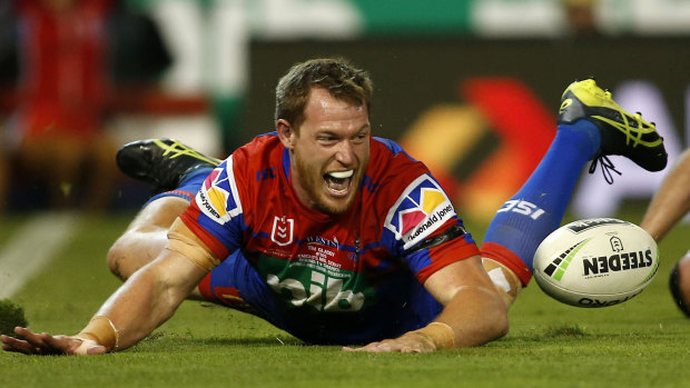 Touchdown: Tim Glasby scores for the Knights on his debut in the red and blue.