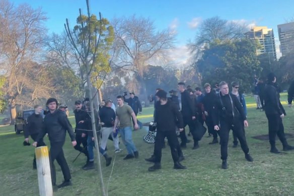 A still from video taken by an Aboriginal activist at Camp Sovereignty shows a group of mostly black-clad men storming the camp in Kings Domain.