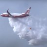 Rain 'taken sting out' of Fraser Island fire, NSW water-bomber goes home