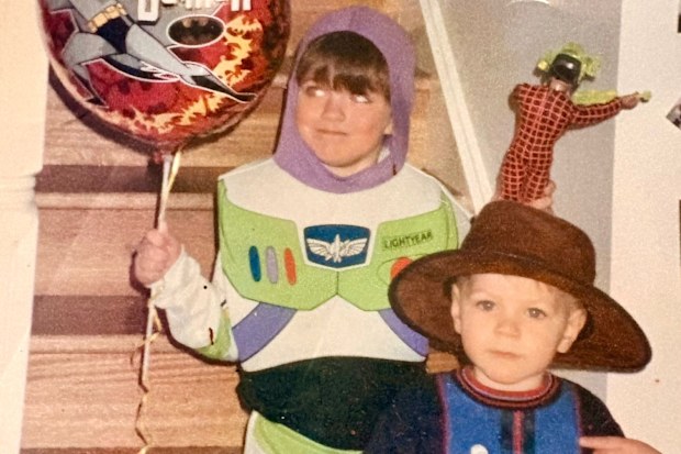 Reid Butler dressed as Buzz Lightyear as a child