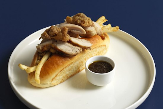 The roast chicken roll with house-made stuffing and fried chicken skin.