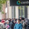 People line up outside a Melbourne Centrelink office at the height of the pandemic in 2020. Fiscal stimulus unleashed during the period will be felt in the economy until 2025, new research shows. 