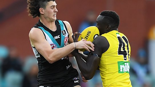 Richmond's Mabior Chol, right, in action against Port Adelaide on Saturday. 
