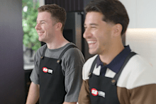 Two footy players put their mixology skills to the test.