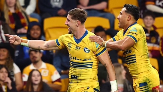 Zac Lomax celebrates a try for Parramatta.