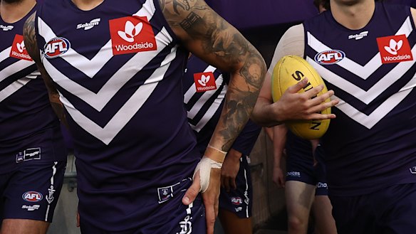 Some Fremantle Dockers supporters want the club to dump Woodside Energy as sponsor.