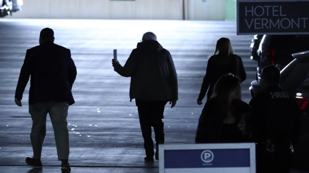 Democratic presidential candidate, Senator Bernie Sanders, centre, walks to his car after speaking to reporters in Burlington, Vermont.