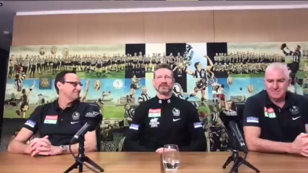 Collingwood CEO Mark Anderson (left), GM of football Graham Wright (right), and senior coach Nathan Buckley (centre).