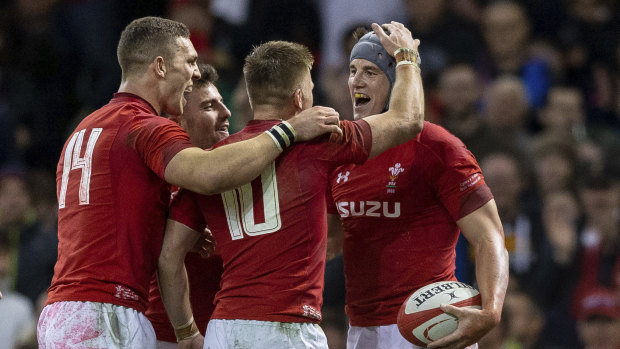 Strong start: Wales celebrate a try en route to victory over Scotland.