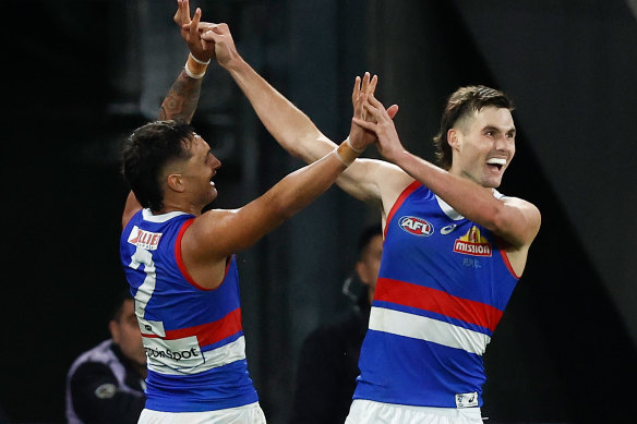 Jamarra Ugle-Hagan (left) and Sam Darcy of the Bulldogs celebrate.