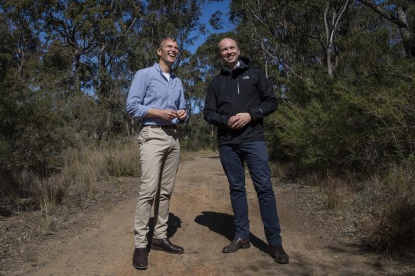 Minister for Planning and Public Spaces, Rob Stokes (left) with  Minister for Energy and Environment, Matthew Kean, at St Helens Park near an area that is part of Sydney's sprawling south-western edge.