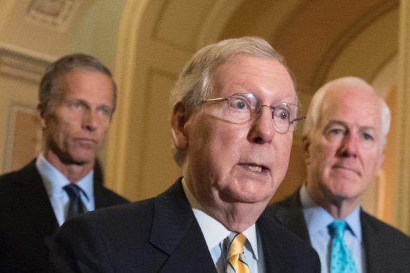 Senate majority leader Mitch McConnell (centre) joined by Senator John Thune (left) and majority whip John Cornyn at a news conference at the Capitol in 2017.