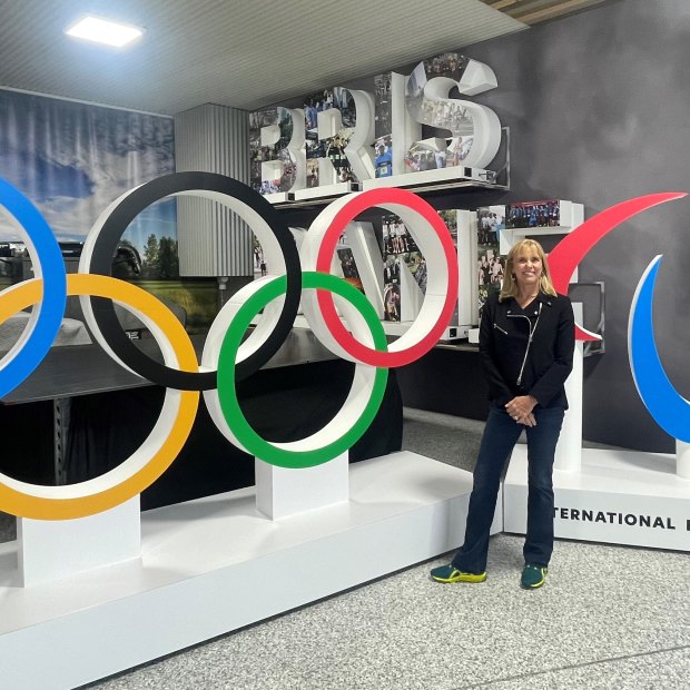 Brisbane 2032 chief executive Cindy Hook, shown with the Olympic rings and agitos, is one of many stakeholders eagerly waiting a final plan for the Games.