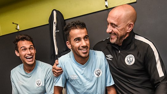 Hakeem Al-Araibi. pictured here with his teammates and coach Vitale Ferrante, is back at training with his Pascoe Vale club.